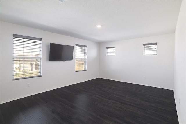 12024 Roving Pass, Elgin, TX 78621 - spare room with dark wood-style floors, baseboards, and recessed lighting