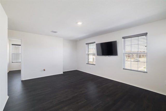 12024 Roving Pass, Elgin, TX 78621 - unfurnished room featuring dark wood-style floors, baseboards, and recessed lighting