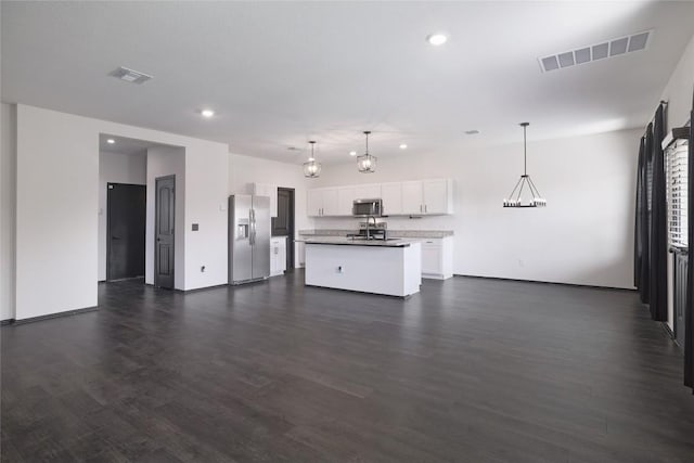 12024 Roving Pass, Elgin, TX 78621 - unfurnished living room featuring recessed lighting, a sink, dark wood finished floors, and baseboards