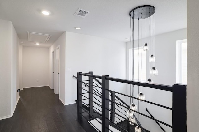 12024 Roving Pass, Elgin, TX 78621 - hallway with an upstairs landing, attic access, wood finished floors, baseboards, and recessed lighting
