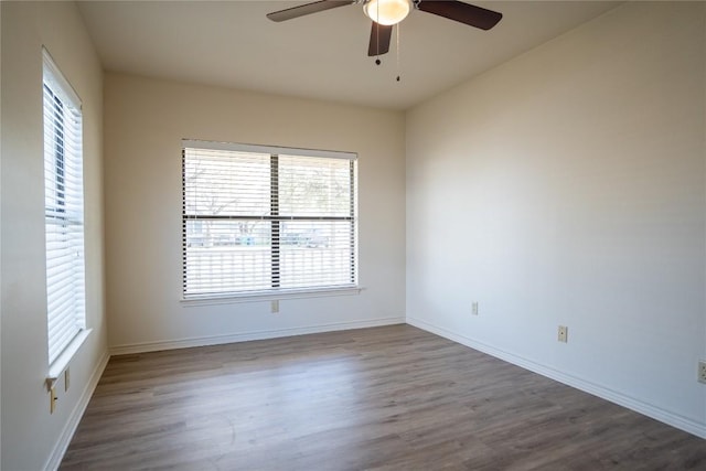 1510 Prather St, Taylor, TX 76574 - spare room with baseboards, wood finished floors, and ceiling fan