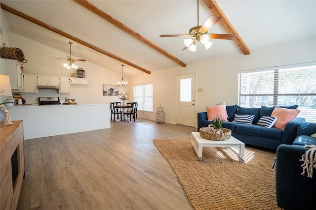 1510 Prather St, Taylor, TX 76574 - living area with beam ceiling, ceiling fan with notable chandelier, light wood-style floors, and high vaulted ceiling