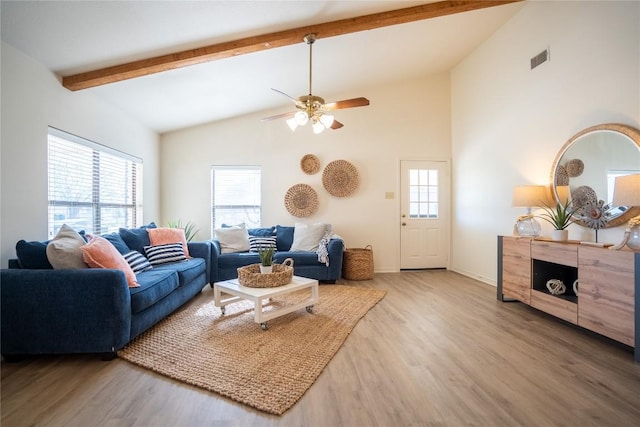 1510 Prather St, Taylor, TX 76574 - living area with ceiling fan, beam ceiling, plenty of natural light, and wood finished floors
