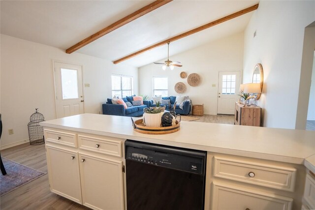 1510 Prather St, Taylor, TX 76574 - kitchen with beam ceiling, wood finished floors, open floor plan, light countertops, and dishwasher