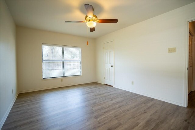 1510 Prather St, Taylor, TX 76574 - empty room with baseboards, a ceiling fan, and wood finished floors