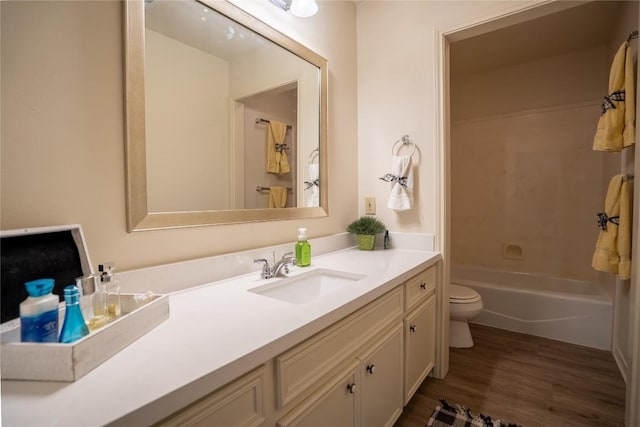 1510 Prather St, Taylor, TX 76574 - bathroom with vanity, toilet, and wood finished floors