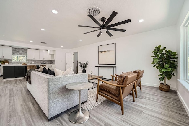 5510 Coventry Ln, Austin, TX 78723 - living room with a ceiling fan, light wood-type flooring, and recessed lighting