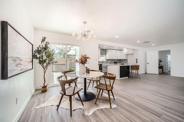 5510 Coventry Ln, Austin, TX 78723 - dining room with light wood finished floors, baseboards, a chandelier, and recessed lighting