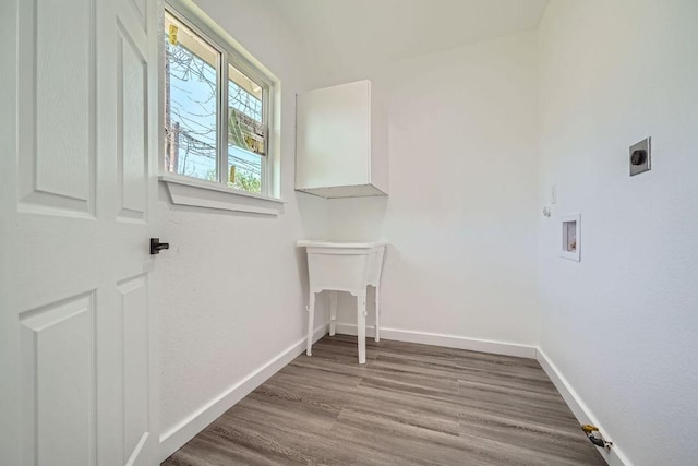 5510 Coventry Ln, Austin, TX 78723 - laundry room featuring hookup for an electric dryer, wood finished floors, and hookup for a washing machine