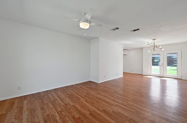 5907 Glenhollow Path, Austin, TX 78745 - spare room with wood finished floors, baseboards, and ceiling fan