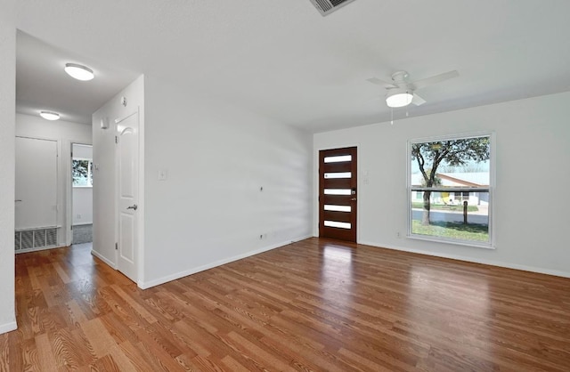 5907 Glenhollow Path, Austin, TX 78745 - foyer entrance featuring healthy amount of natural light, wood finished floors, ceiling fan, and baseboards