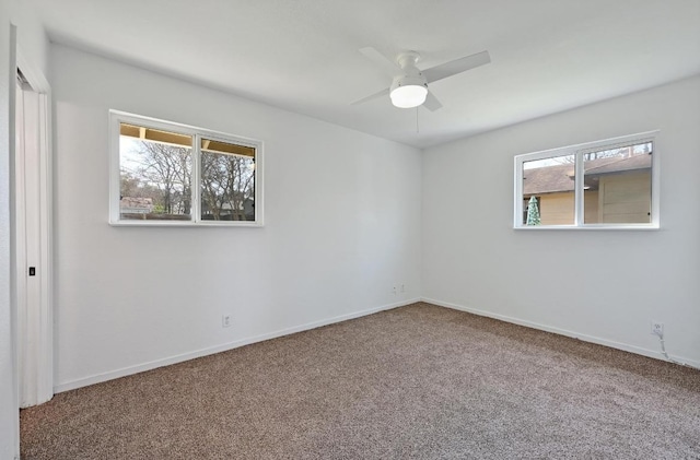 5907 Glenhollow Path, Austin, TX 78745 - unfurnished bedroom featuring carpet flooring, baseboards, and a ceiling fan