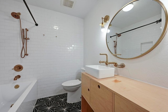 5907 Glenhollow Path, Austin, TX 78745 - bathroom with vanity, tub / shower combination, toilet, and tile patterned flooring