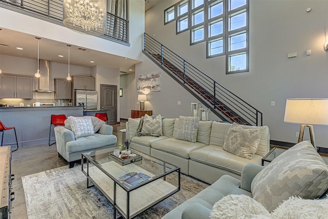2612 Hidalgo St, Austin, TX 78702 - living area with a high ceiling, stairway, and concrete flooring