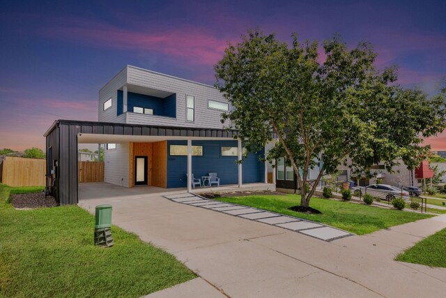 5809 Toscana Ave, Austin, TX 78724 - contemporary house with concrete driveway and an attached carport