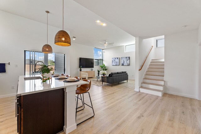 5809 Toscana Ave, Austin, TX 78724 - kitchen with ceiling fan, plenty of natural light, light wood-type flooring, and light countertops