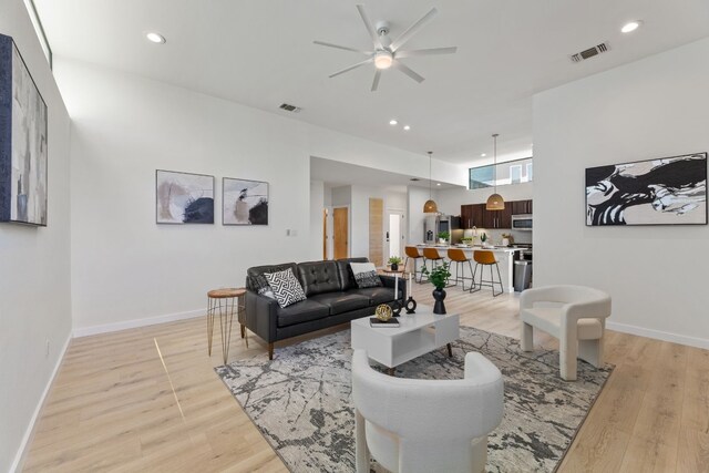 5809 Toscana Ave, Austin, TX 78724 - living area featuring ceiling fan, light wood-style flooring, baseboards, and recessed lighting