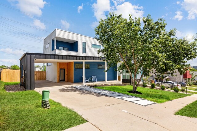 5809 Toscana Ave, Austin, TX 78724 - contemporary home featuring driveway and a carport