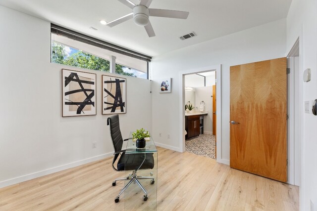 5809 Toscana Ave, Austin, TX 78724 - home office with ceiling fan, light wood finished floors, and baseboards