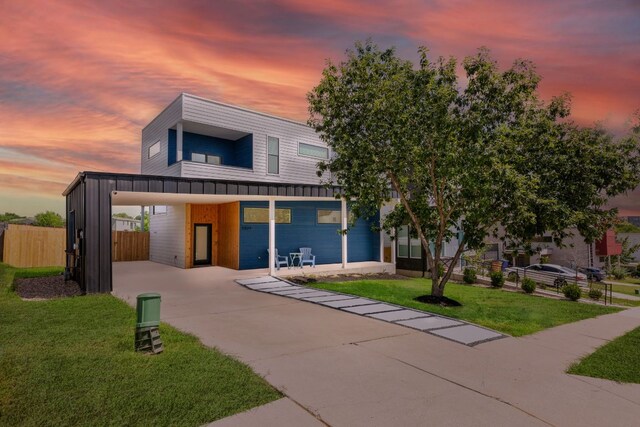 5809 Toscana Ave, Austin, TX 78724 - modern home featuring concrete driveway and a carport