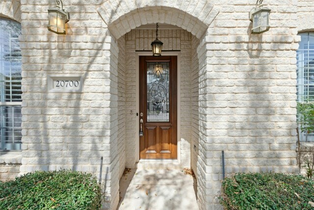 20700 Windmill Ridge St, Pflugerville, TX 78660 - property entrance with brick siding and stone siding