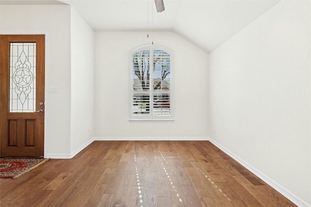 20700 Windmill Ridge St, Pflugerville, TX 78660 - foyer entrance with wood finished floors, a ceiling fan, baseboards, and lofted ceiling