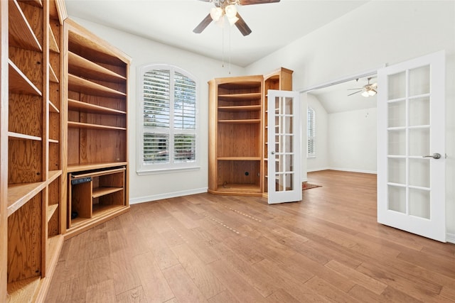 20700 Windmill Ridge St, Pflugerville, TX 78660 - spacious closet with french doors, a ceiling fan, and wood finished floors