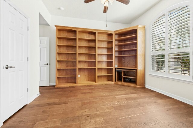 20700 Windmill Ridge St, Pflugerville, TX 78660 - unfurnished bedroom with light wood-style floors, baseboards, lofted ceiling, and ceiling fan