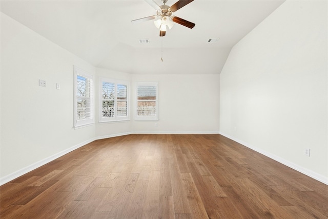 20700 Windmill Ridge St, Pflugerville, TX 78660 - unfurnished room featuring ceiling fan, wood finished floors, lofted ceiling, and baseboards