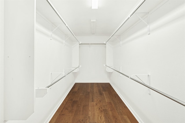 20700 Windmill Ridge St, Pflugerville, TX 78660 - walk in closet featuring dark wood finished floors