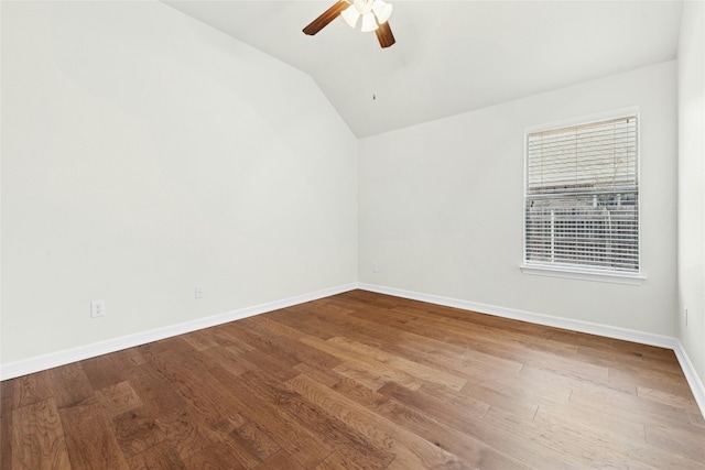 20700 Windmill Ridge St, Pflugerville, TX 78660 - spare room featuring ceiling fan, baseboards, lofted ceiling, and wood finished floors