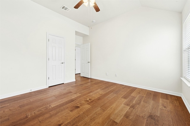 20700 Windmill Ridge St, Pflugerville, TX 78660 - unfurnished bedroom featuring light wood-style floors, baseboards, ceiling fan, vaulted ceiling, and multiple windows