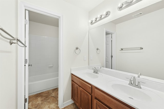 20700 Windmill Ridge St, Pflugerville, TX 78660 - full bathroom featuring double vanity and shower / washtub combination