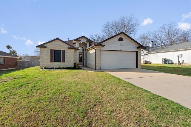 ranch-style house with a front lawn, fence, brick siding, an attached garage, and driveway