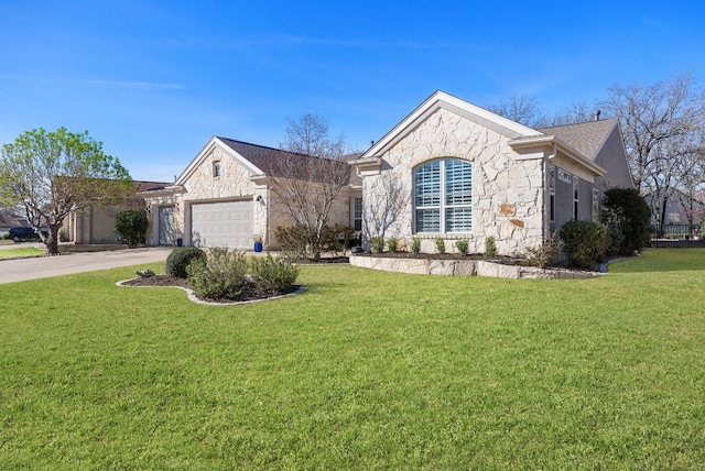 view of front facade featuring a garage, stone siding, concrete driveway, and a front yard