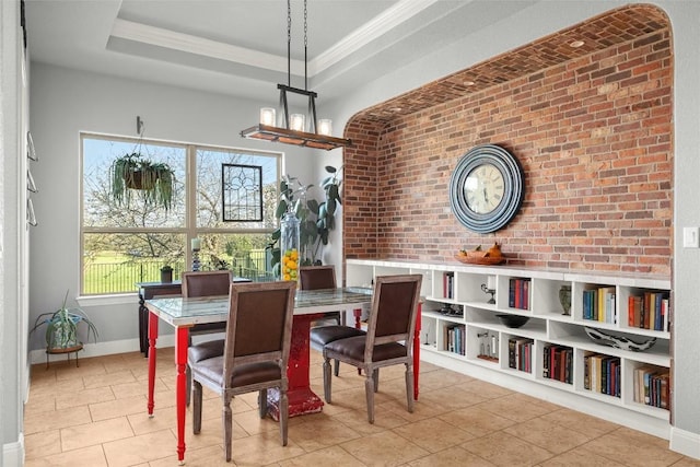 362 Wellington Dr, Austin, TX 78737 - tiled dining room with crown molding, brick wall, and baseboards