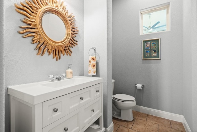 362 Wellington Dr, Austin, TX 78737 - bathroom with vanity, baseboards, tile patterned flooring, and toilet