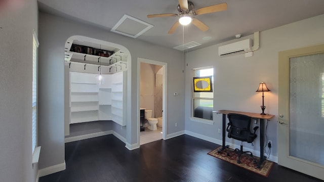 362 Wellington Dr, Austin, TX 78737 - interior space featuring visible vents, wood finished floors, baseboards, a wall mounted air conditioner, and a ceiling fan