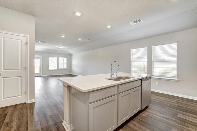 152 Greenway Ln, Georgetown, TX 78628 - kitchen featuring stainless steel dishwasher, dark wood-type flooring, a kitchen island with sink, recessed lighting, and open floor plan