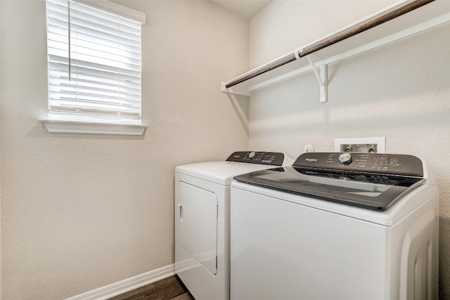 152 Greenway Ln, Georgetown, TX 78628 - washroom featuring separate washer and dryer and wood finished floors