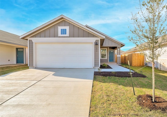 152 Greenway Ln, Georgetown, TX 78628 - single story home featuring board and batten siding, concrete driveway, and a garage