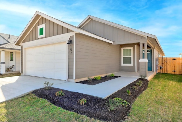 152 Greenway Ln, Georgetown, TX 78628 - view of front of property featuring board and batten siding, a garage, and driveway