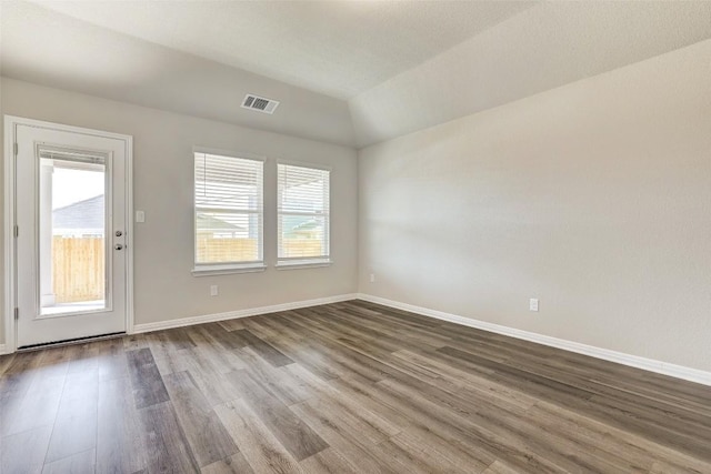 152 Greenway Ln, Georgetown, TX 78628 - unfurnished room with dark wood-type flooring and vaulted ceiling
