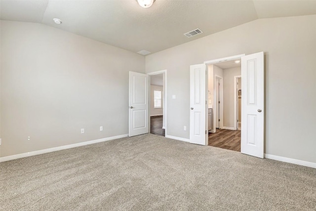 152 Greenway Ln, Georgetown, TX 78628 - unfurnished bedroom with lofted ceiling and carpet