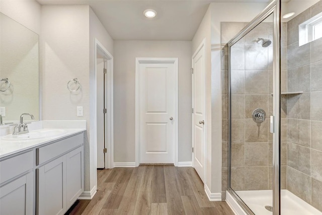 152 Greenway Ln, Georgetown, TX 78628 - bathroom featuring vanity, a shower stall, and wood finished floors