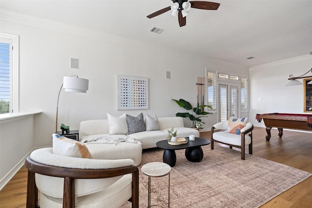 living room with wood finished floors, billiards, ceiling fan, ornamental molding, and visible vents
