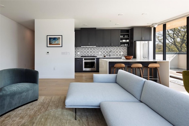1600 S 1st St Unit 219, Austin, TX 78704 - living area with light wood-style floors and baseboards
