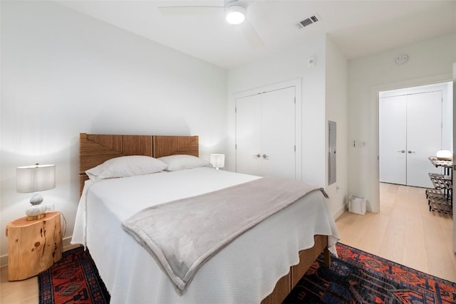 1600 S 1st St Unit 219, Austin, TX 78704 - bedroom with wood finished floors, a closet, ceiling fan, and baseboards