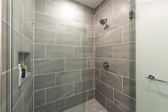 1600 S 1st St Unit 219, Austin, TX 78704 - full bathroom featuring a tile shower
