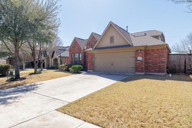 2532 Santa Barbara Loop, Round Rock, TX 78665 - view of front of property featuring brick siding, a garage, and driveway